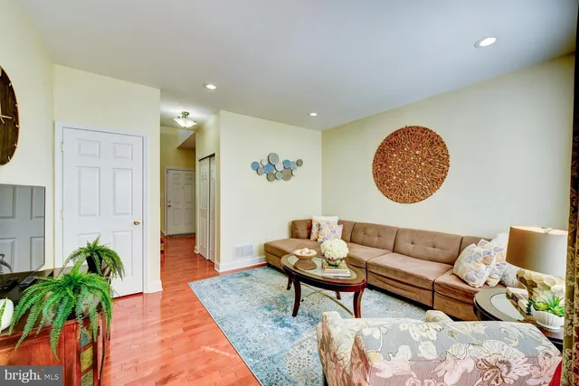 a living room with furniture and a rug