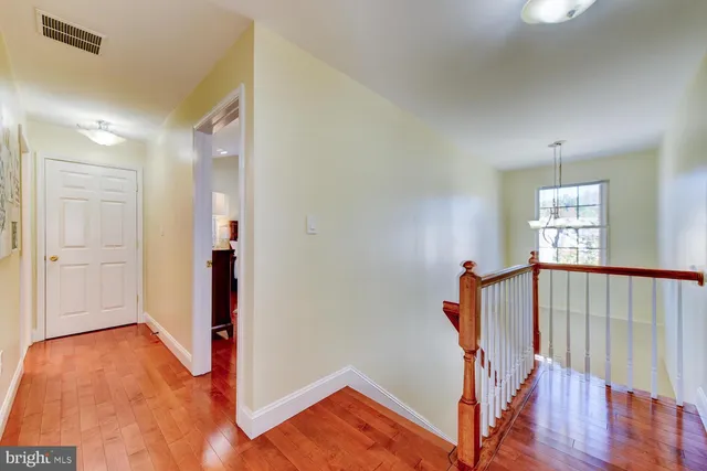 a view of entryway with stairs and wooden floor