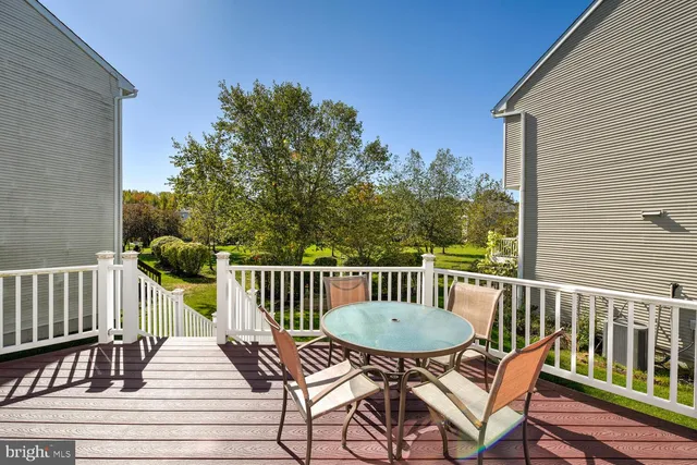 a view of a chairs in wooden deck