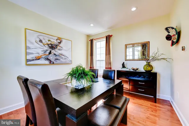 a view of a dining room with furniture and window