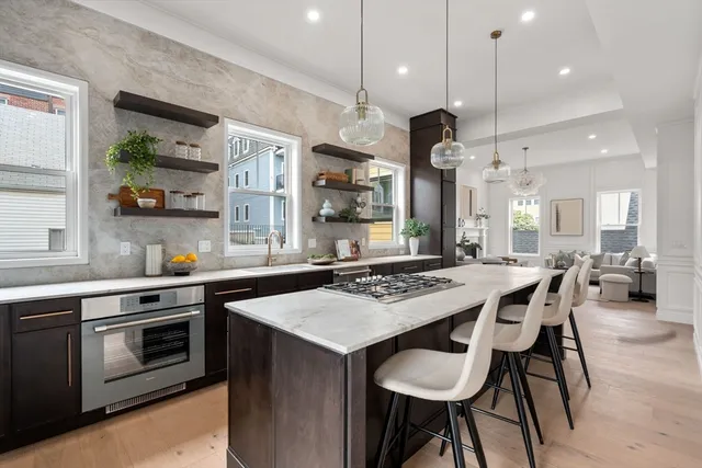 a kitchen with a dining table and chairs
