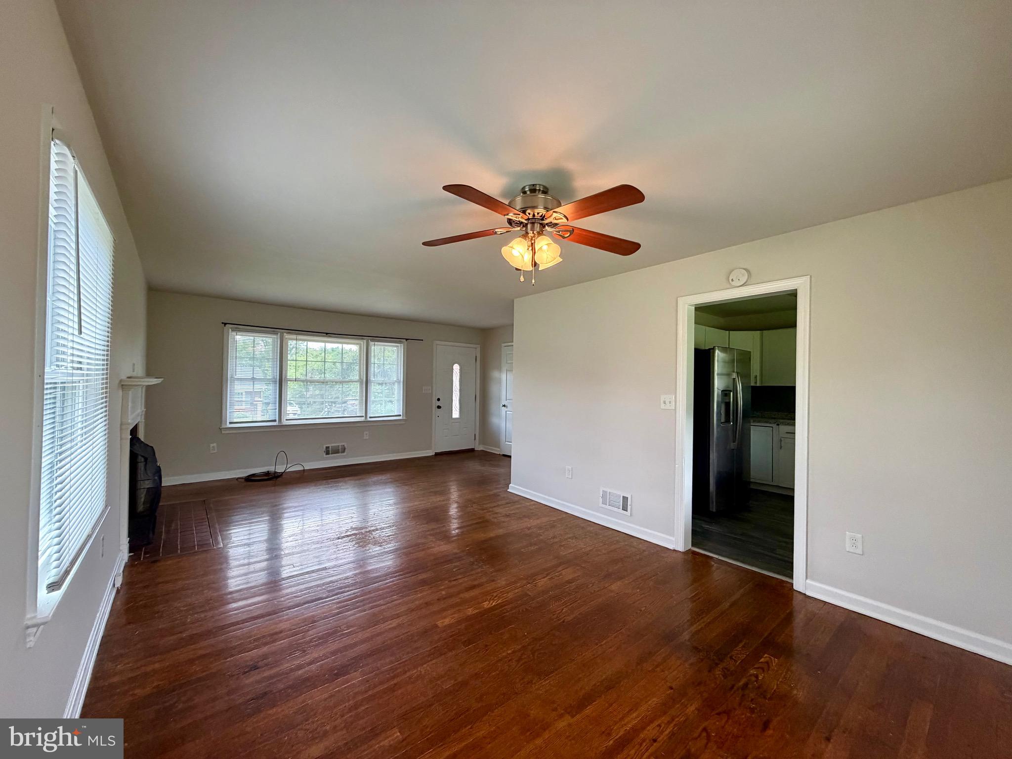 1010 Nottingham Street Culpeper, VA 22701 - Photo 14 of 21 an empty room with wooden floor and windows