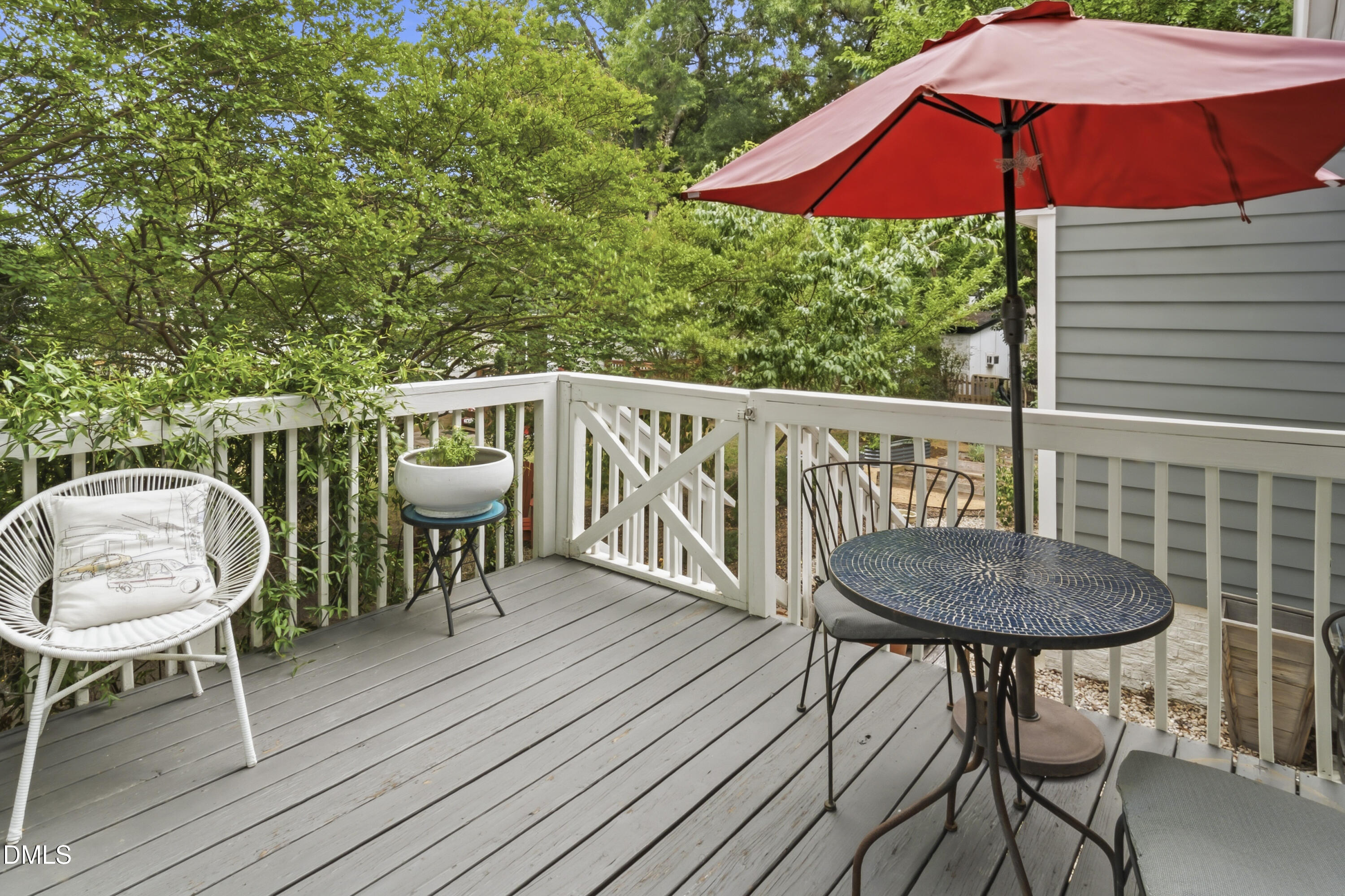 3004 West Annaley Drive Raleigh, NC 27604 - Photo 22 of 44 a balcony with table and chairs