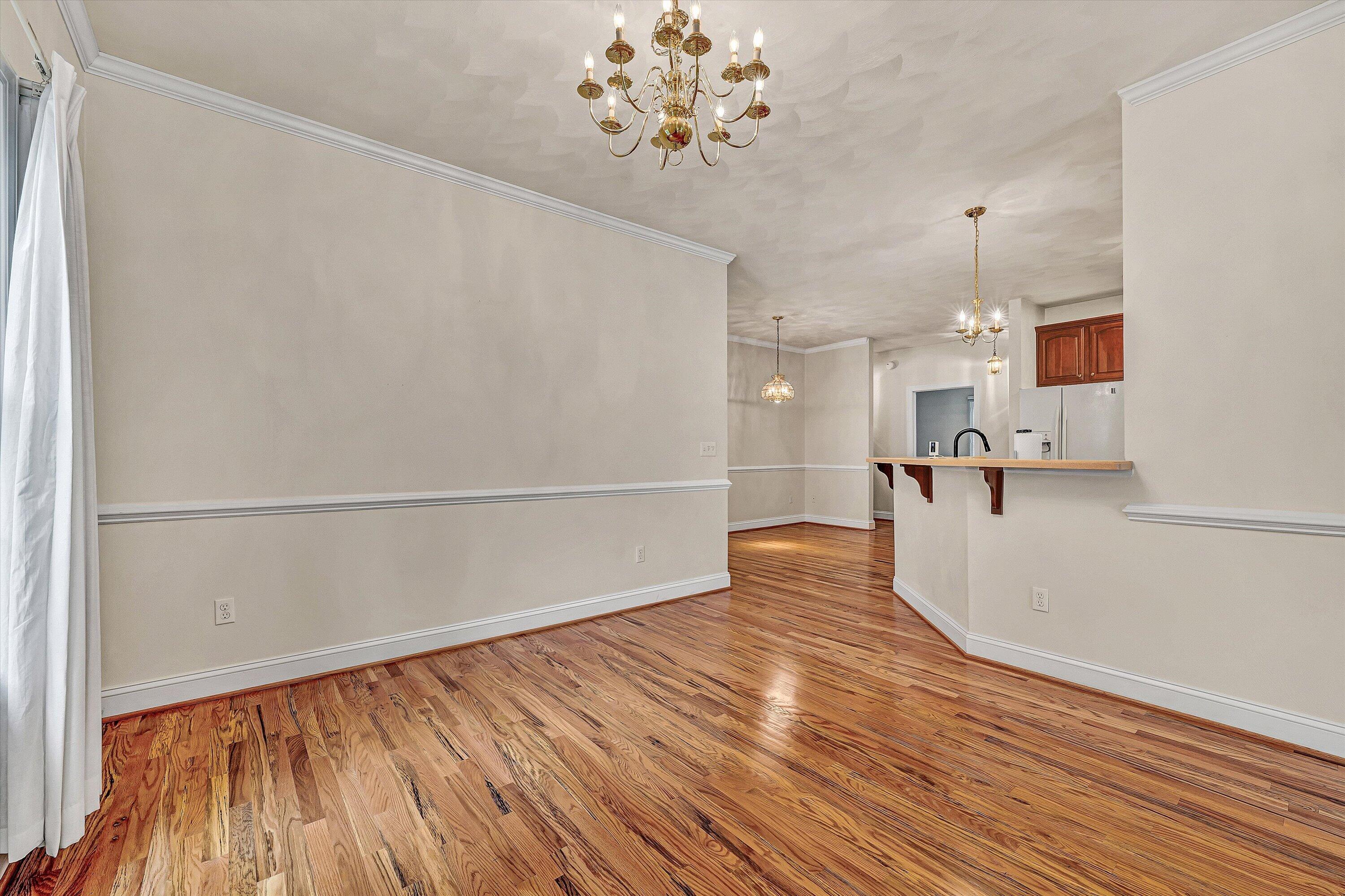 131 Stoney Mill Road Rocky Mount, VA 24151 - Photo 7 of 37 a view of kitchen and empty room with wooden floor