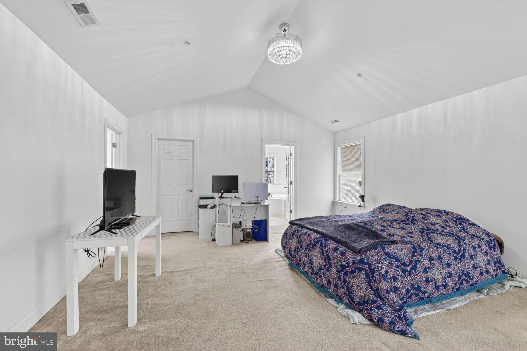 15900 Tanyard Road Upper Marlboro, MD 20772 - Photo 11 of 34 a bedroom with a bed and a flat screen tv