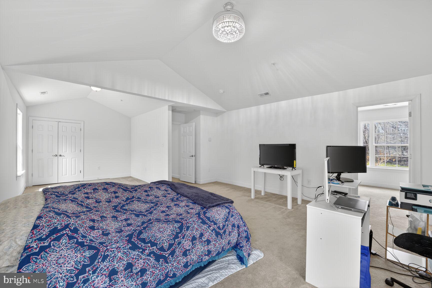 15900 Tanyard Road Upper Marlboro, MD 20772 - Photo 12 of 34 a bedroom with a bed and a flat screen tv