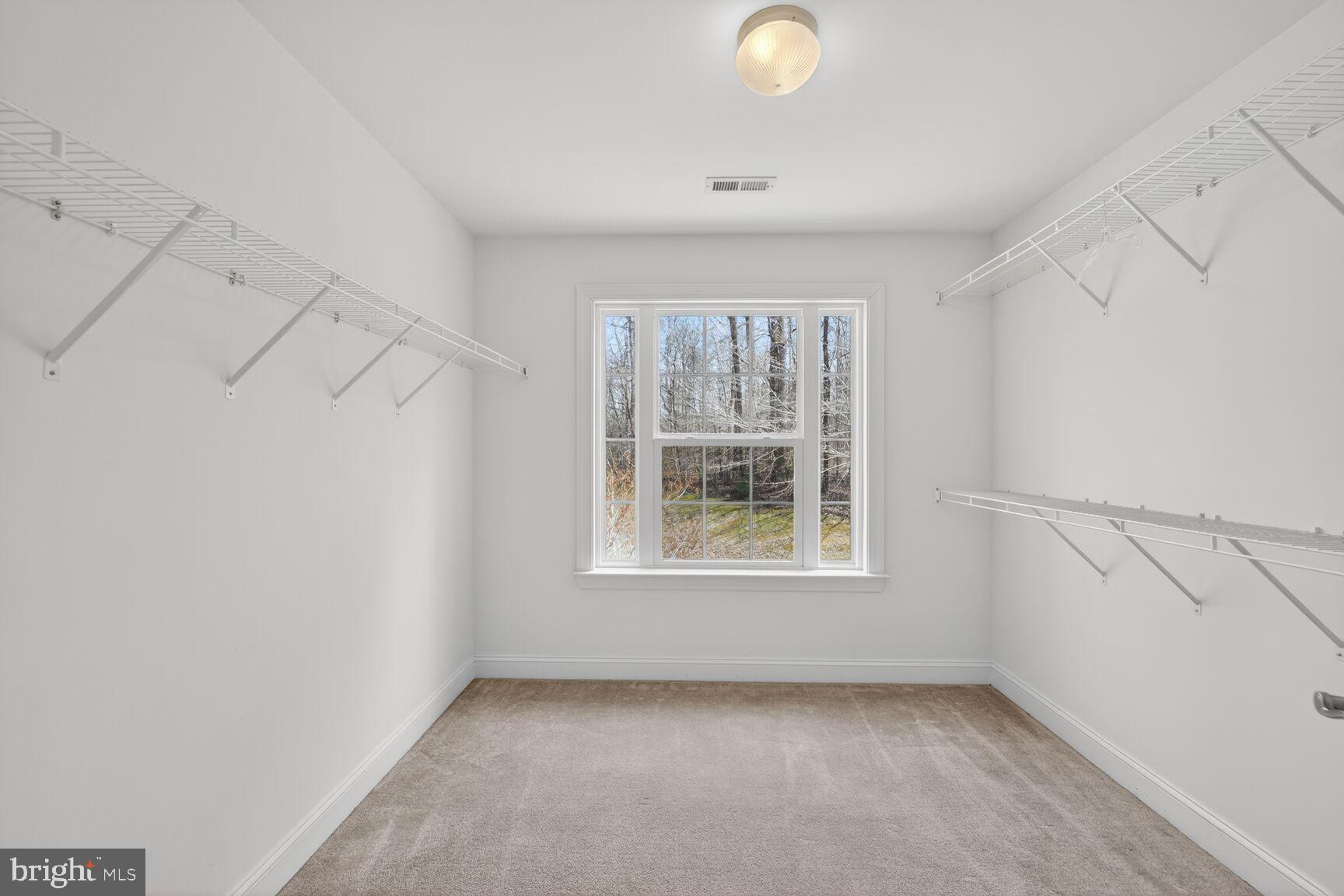 15900 Tanyard Road Upper Marlboro, MD 20772 - Photo 15 of 34 an empty room with windows and closet