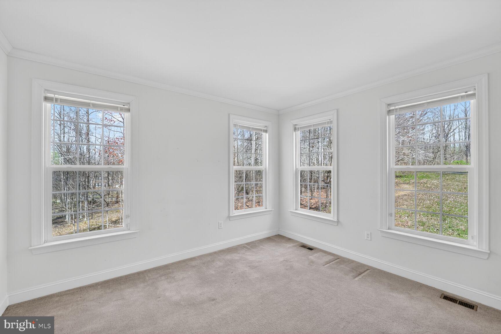 15900 Tanyard Road Upper Marlboro, MD 20772 - Photo 17 of 34 a view of an empty room with windows