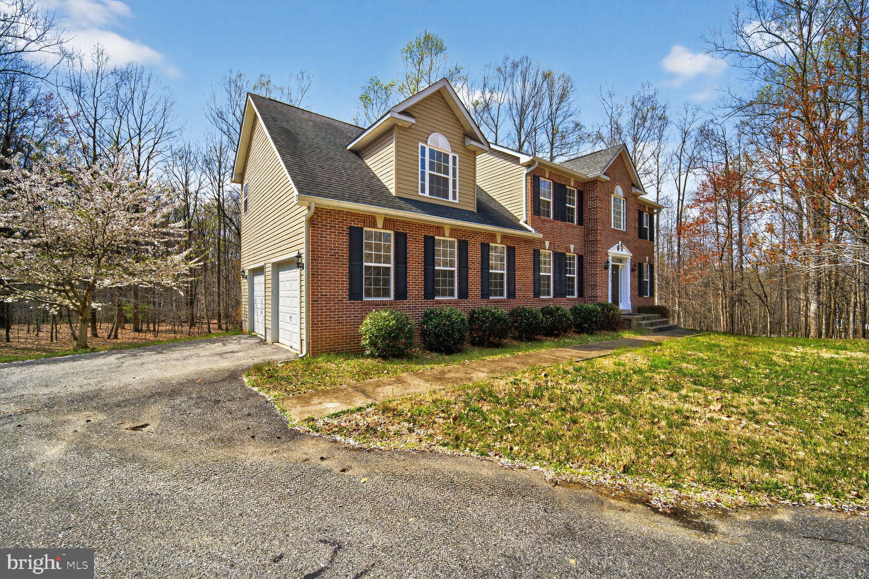 15900 Tanyard Road Upper Marlboro, MD 20772 - Photo 2 of 34 a front view of a house with a yard