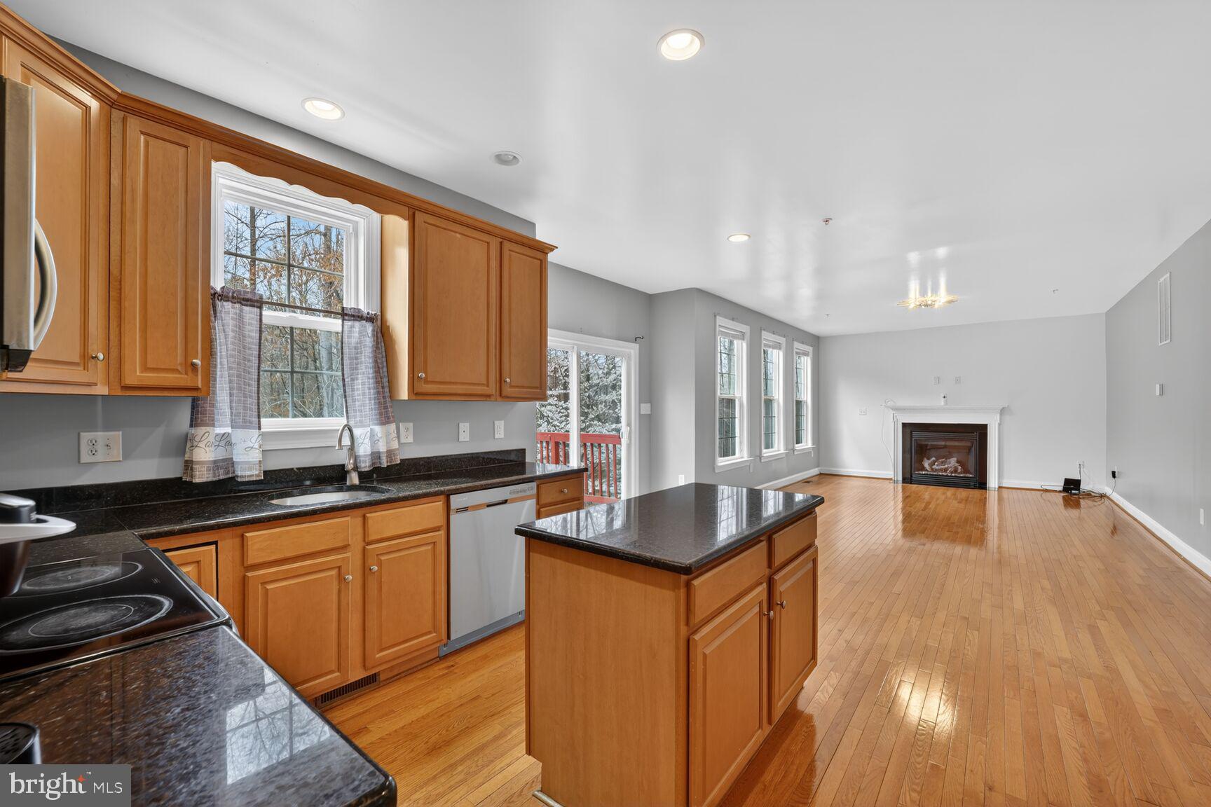 15900 Tanyard Road Upper Marlboro, MD 20772 - Photo 24 of 34 a kitchen with granite countertop lots of counter top space and stainless steel appliances