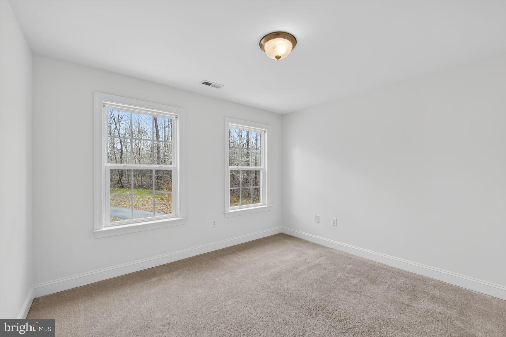 15900 Tanyard Road Upper Marlboro, MD 20772 - Photo 26 of 34 an empty room with windows