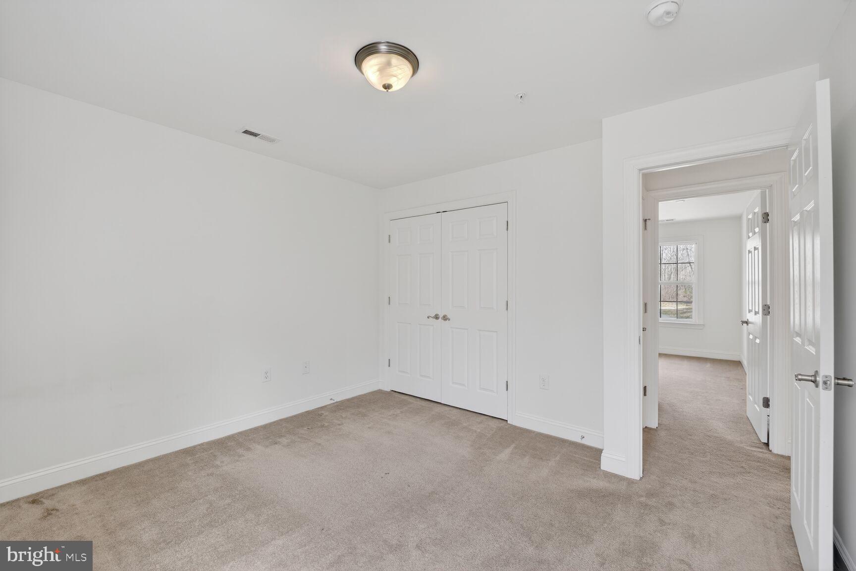 15900 Tanyard Road Upper Marlboro, MD 20772 - Photo 7 of 34 an empty room with a empty space and a window