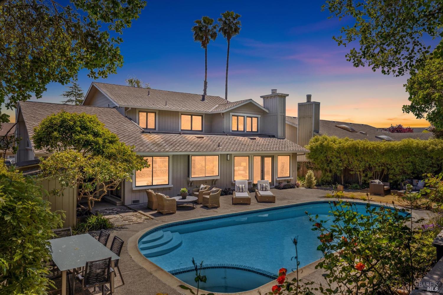 a front view of a house with yard and seating area