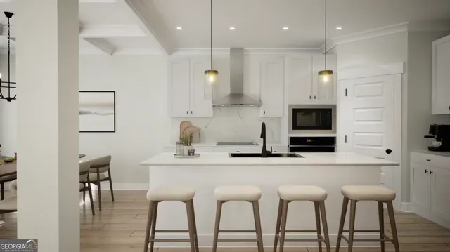 a kitchen with stainless steel appliances kitchen island granite countertop a table chairs microwave and sink