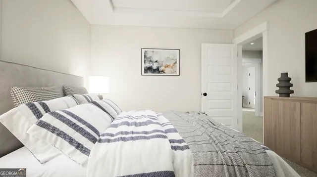 a bedroom with a bed and a painting on the wall
