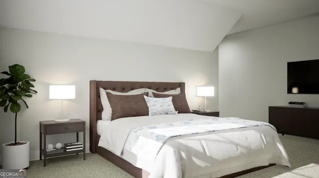 a bedroom with a bed and a potted plant