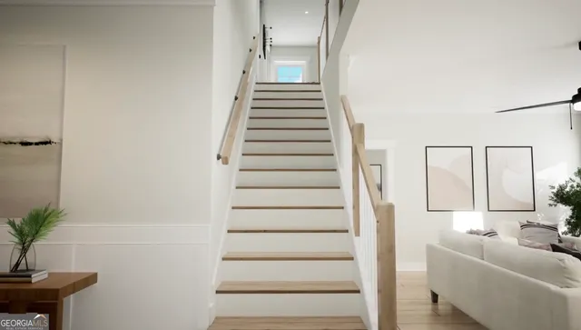 a view of entryway and hall with wooden floor