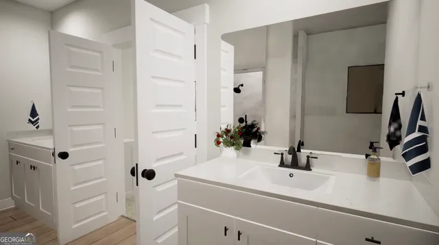 a bathroom with a sink and a mirror