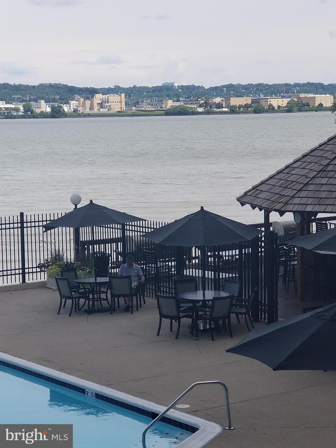 501 Slaters Lane, Unit 502 Alexandria, VA 22314 - Photo 9 of 24 Tiki Bar and grilling area by pool
