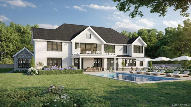a front view of a house with a yard table and chairs