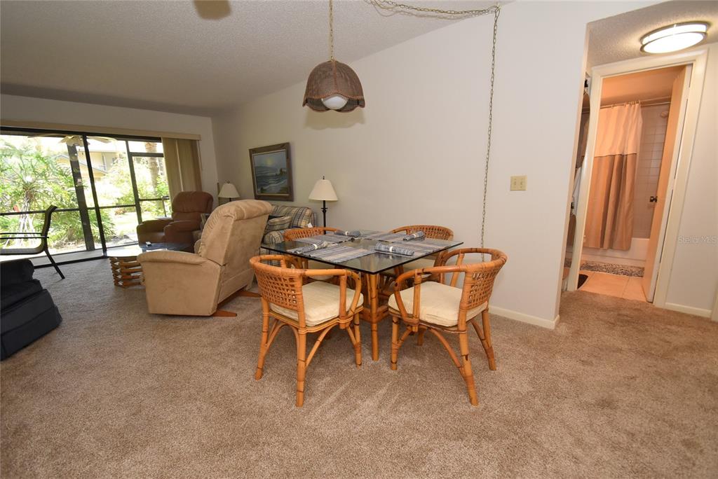 1709 Pelican Cove Road, Unit GL349 Sarasota, FL 34231 - Photo 4 of 29 a living room with furniture and a large window