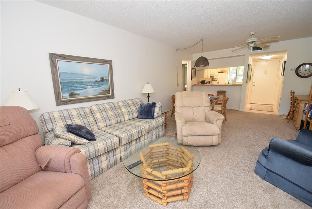 1709 Pelican Cove Road, Unit GL349 Sarasota, FL 34231 - Photo 8 of 29 a living room with furniture and a couch