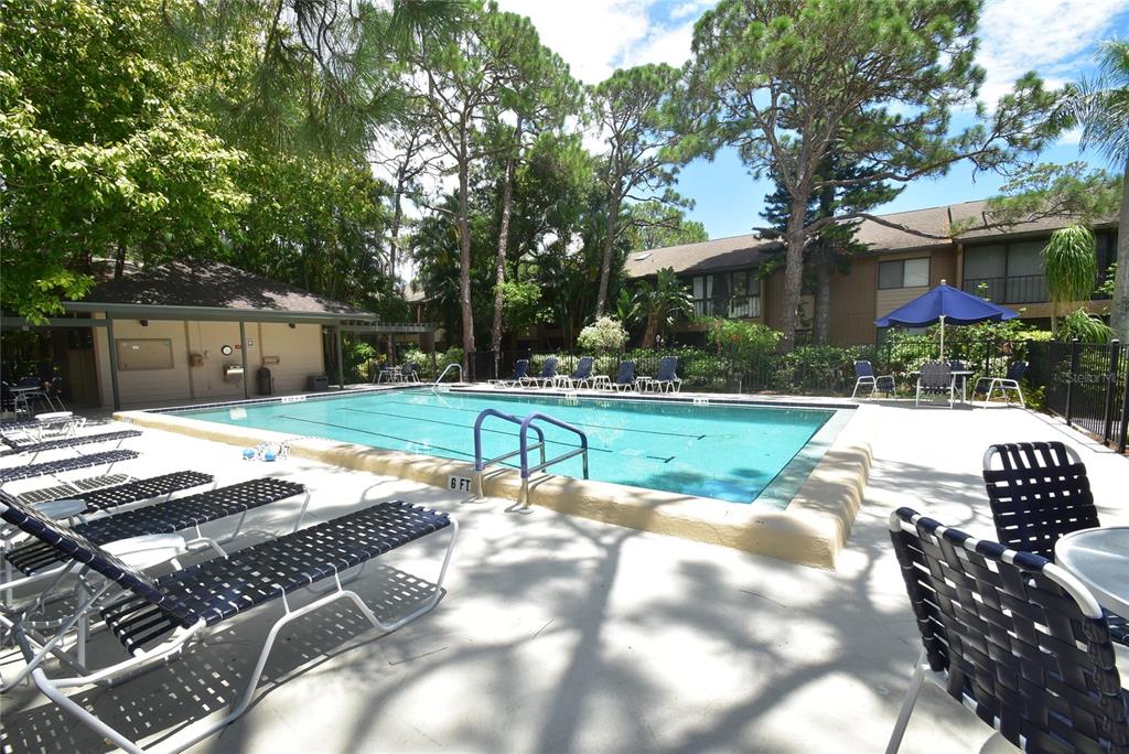 1709 Pelican Cove Road, Unit GL349 Sarasota, FL 34231 - Photo 10 of 29 a view of a house with a backyard