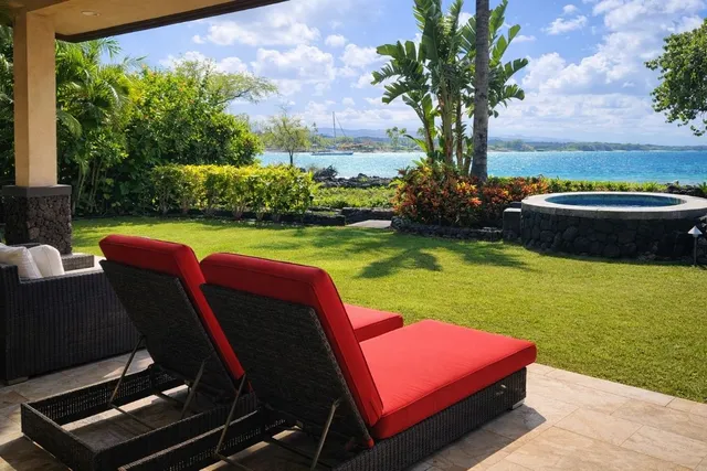 a view of a backyard with sitting area