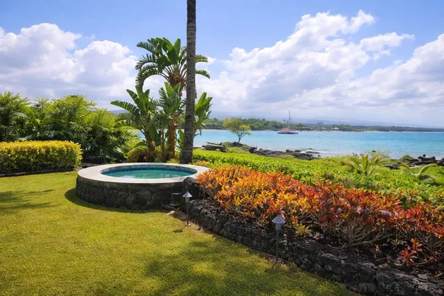 a view of a swimming pool with a yard
