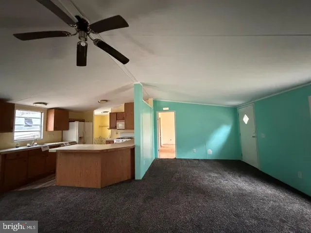 a view of a kitchen with a sink cabinets and window