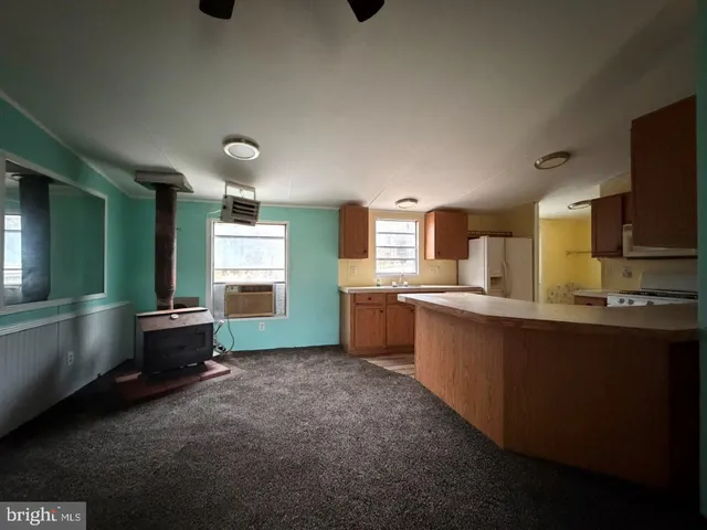 a kitchen with stainless steel appliances a microwave a stove and refrigerator