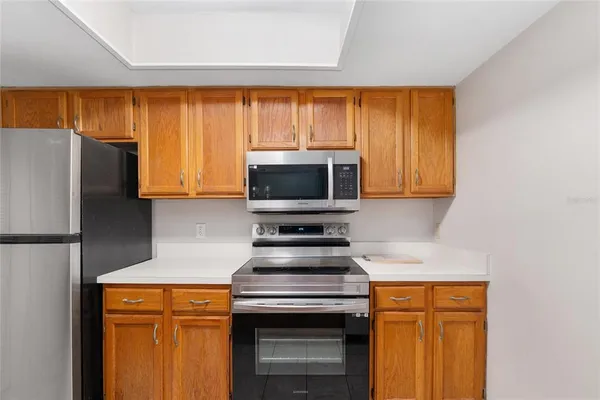 a kitchen with stainless steel appliances a stove and a refrigerator
