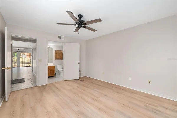 a view of a livingroom with a ceiling fan and window