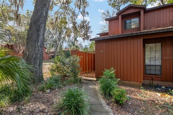 a house with trees in front of it