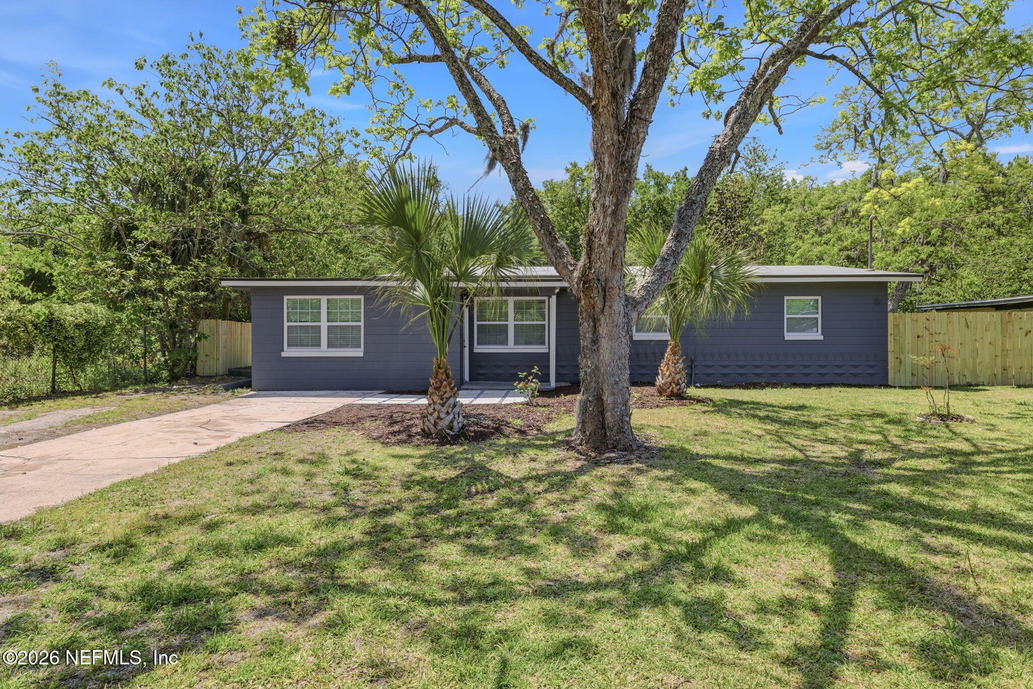 10184 Herndon Road Jacksonville, FL 32246 - Photo 1 of 28 a house with trees in front of it