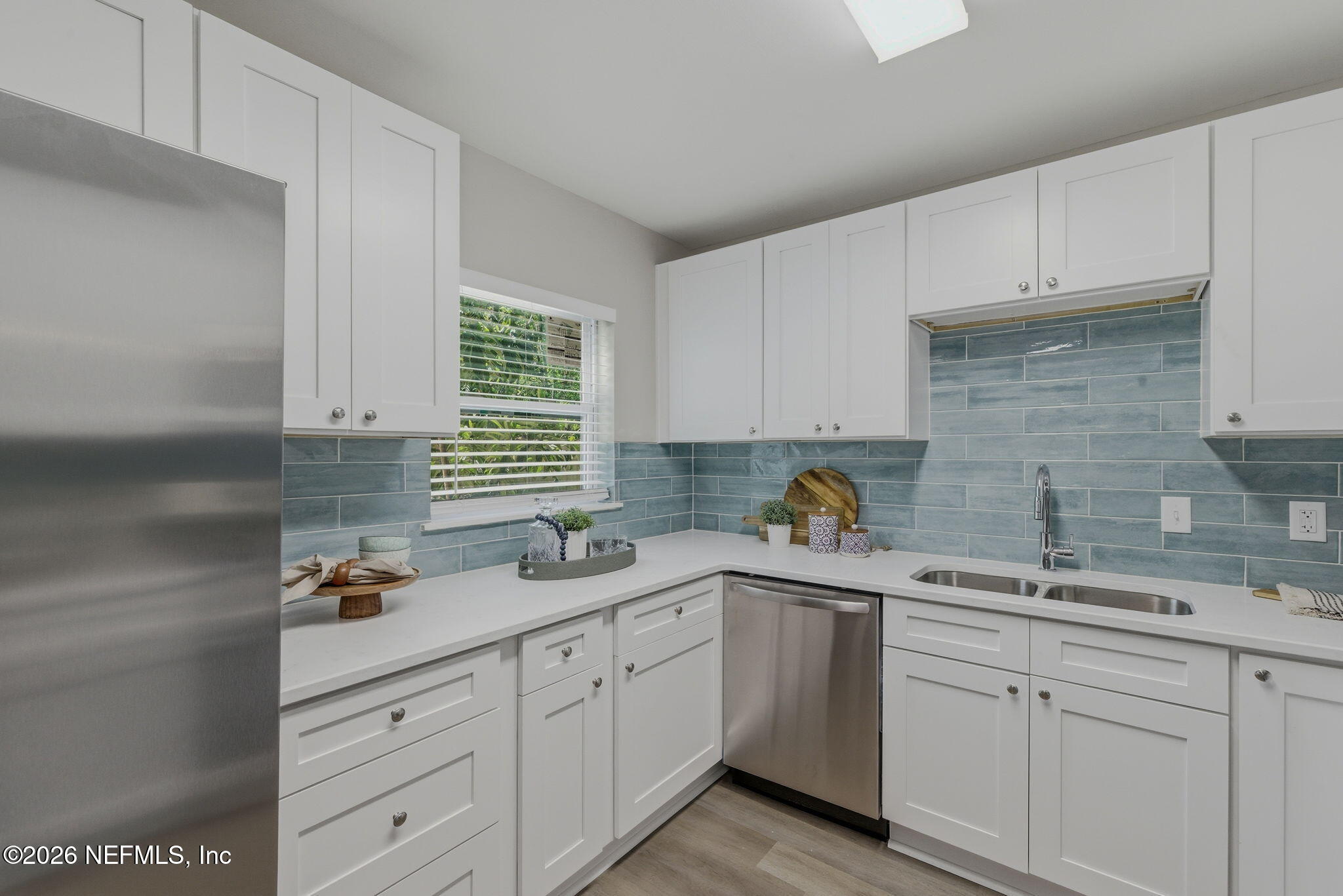 10184 Herndon Road Jacksonville, FL 32246 - Photo 15 of 28 a kitchen with white cabinets and white appliances