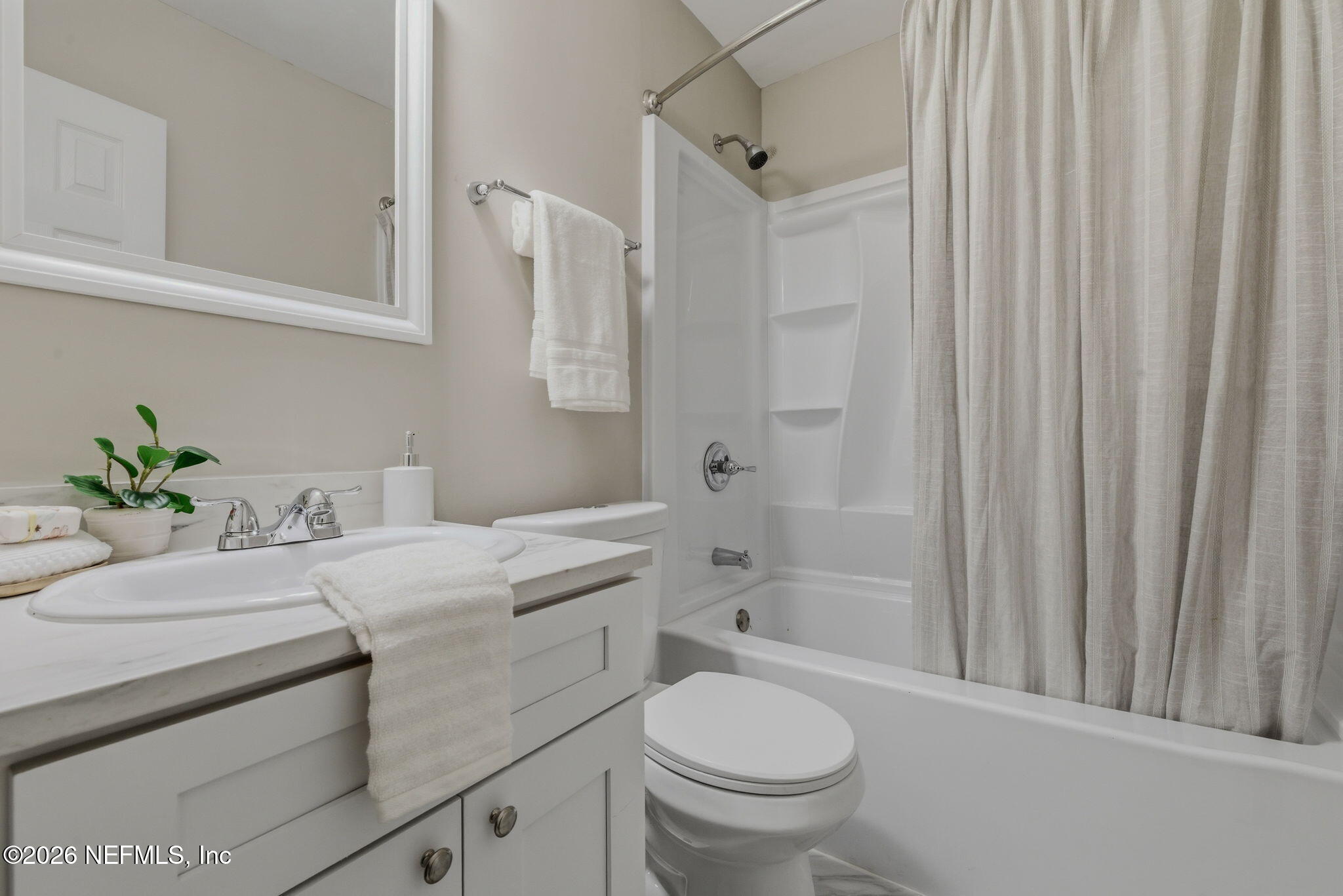10184 Herndon Road Jacksonville, FL 32246 - Photo 16 of 28 a bathroom with a sink toilet and shower