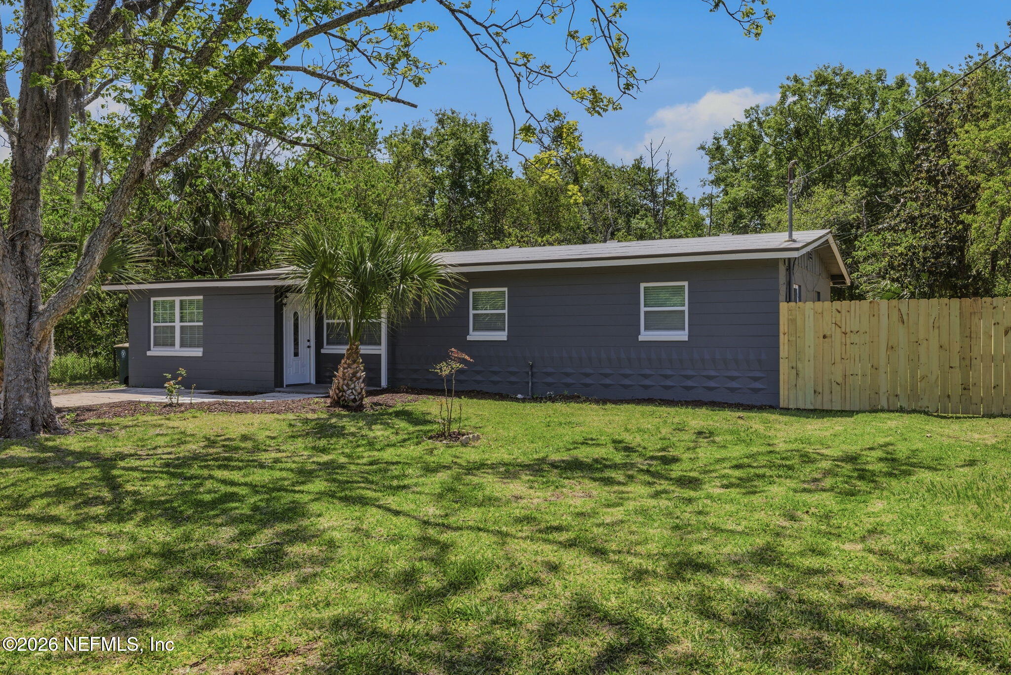 10184 Herndon Road Jacksonville, FL 32246 - Photo 2 of 28 front view of house with a yard