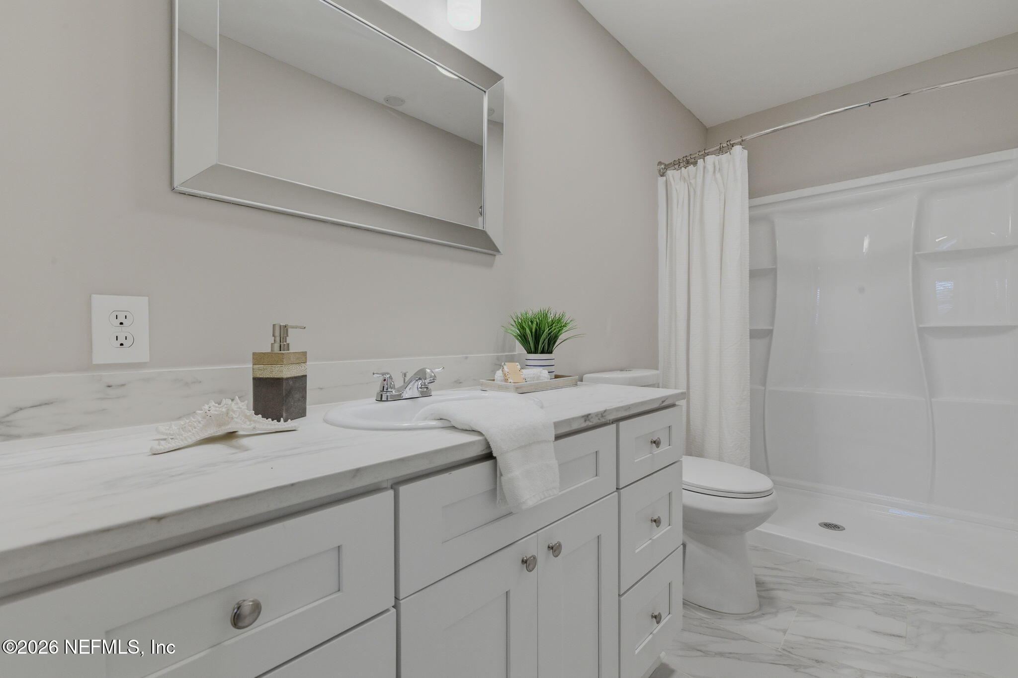 10184 Herndon Road Jacksonville, FL 32246 - Photo 22 of 28 a bathroom with a granite countertop sink a toilet and shower