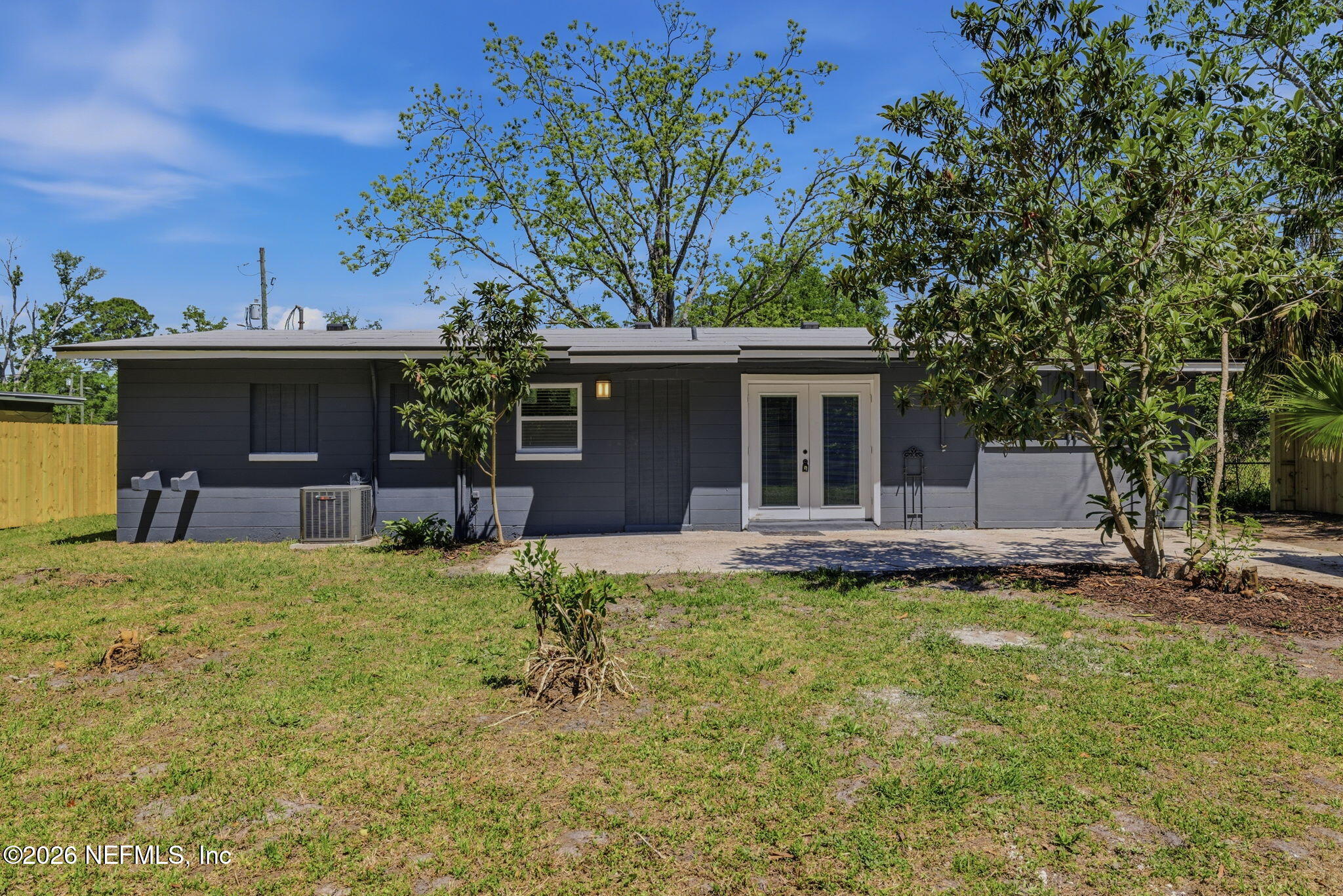 10184 Herndon Road Jacksonville, FL 32246 - Photo 26 of 28 front view of a house with a yard