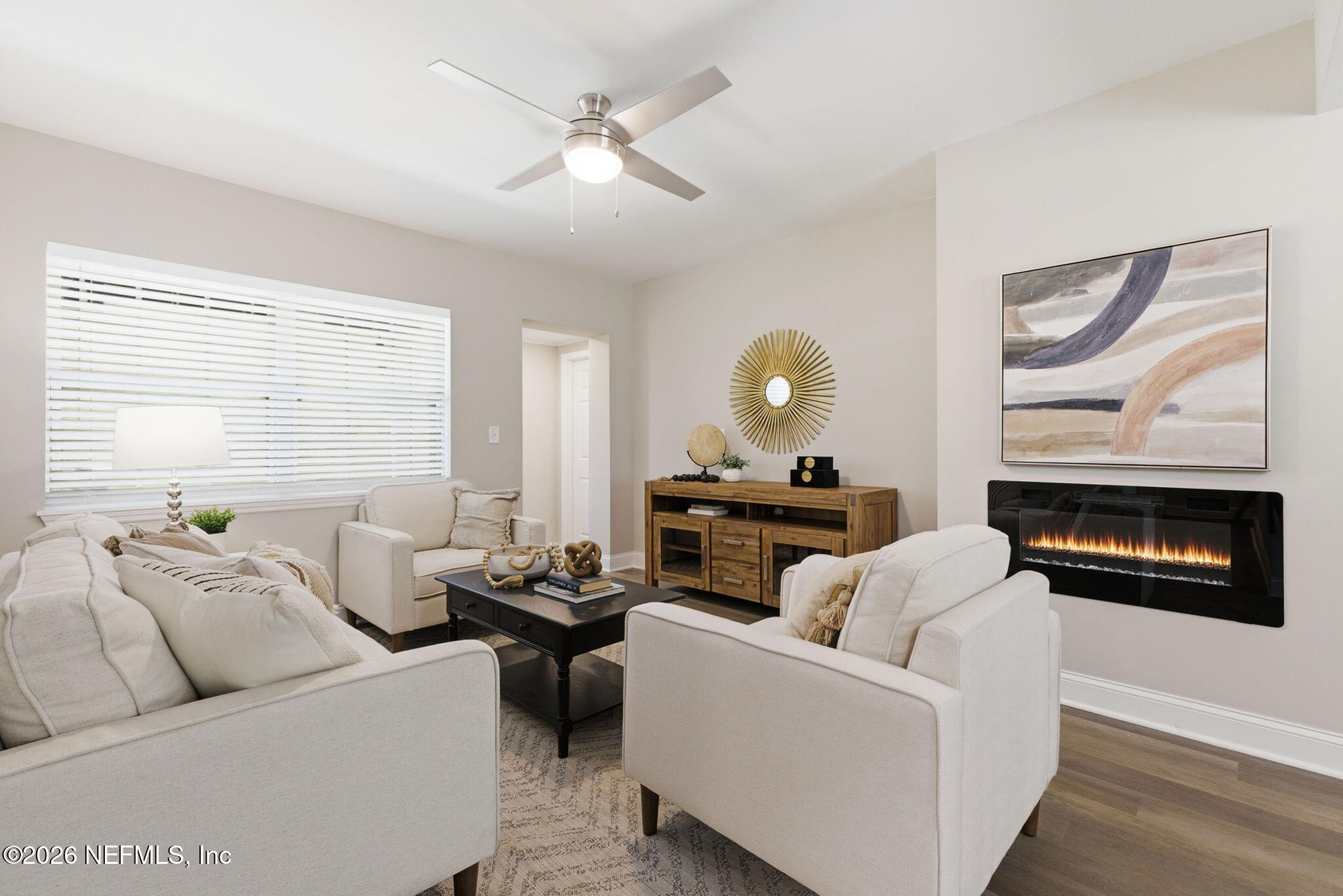 10184 Herndon Road Jacksonville, FL 32246 - Photo 6 of 28 a living room with furniture and a fireplace