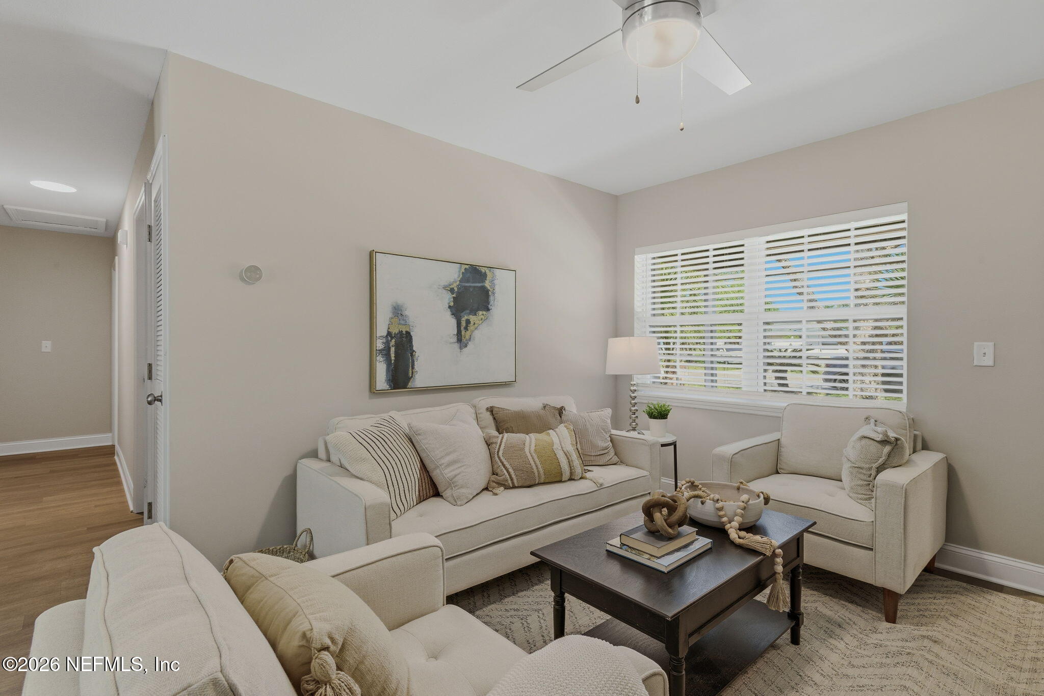 10184 Herndon Road Jacksonville, FL 32246 - Photo 7 of 28 a living room with furniture and a large window