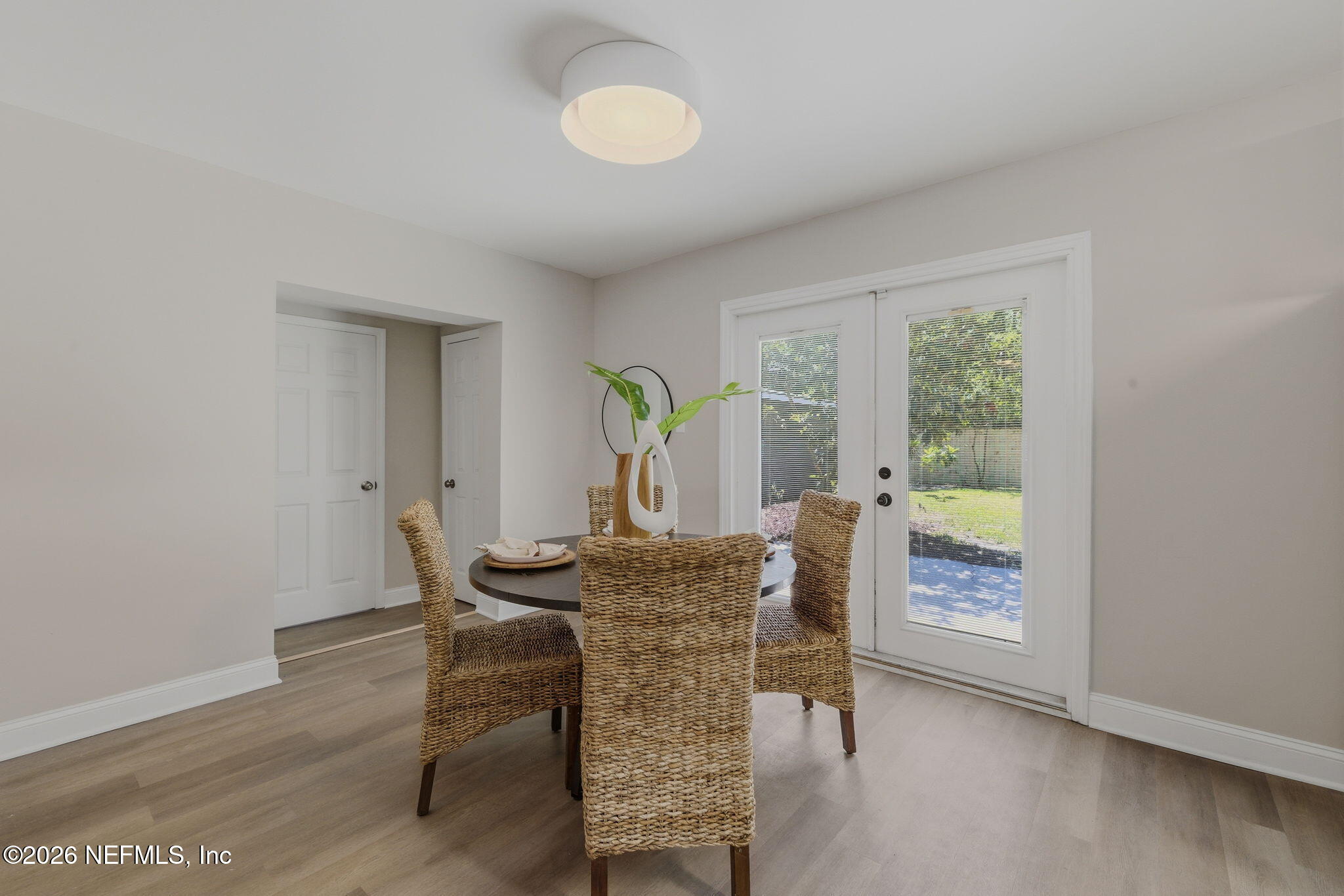 10184 Herndon Road Jacksonville, FL 32246 - Photo 9 of 28 a view of a dining room with furniture and wooden floor