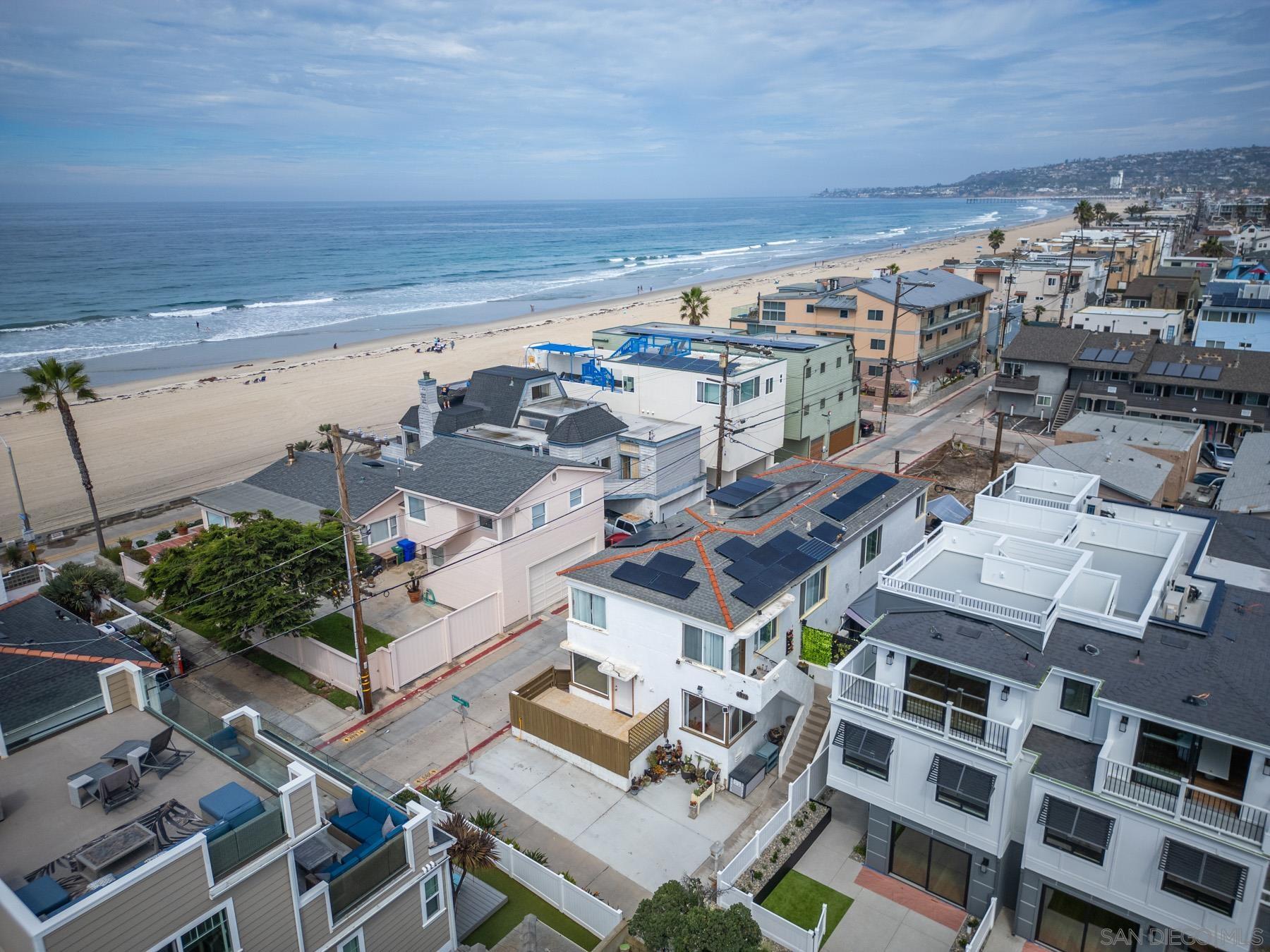 an aerial view of a building with garden space and parking space