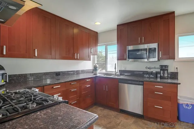 a kitchen with a sink and a window