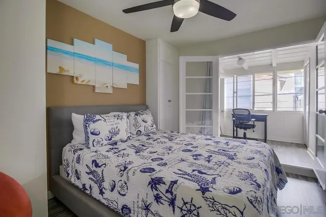 a view of a dining room with furniture and a window