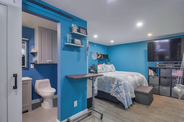 a kitchen with stainless steel appliances granite countertop a refrigerator a stove and a refrigerator