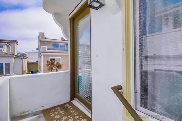 a living room with furniture and a ceiling fan