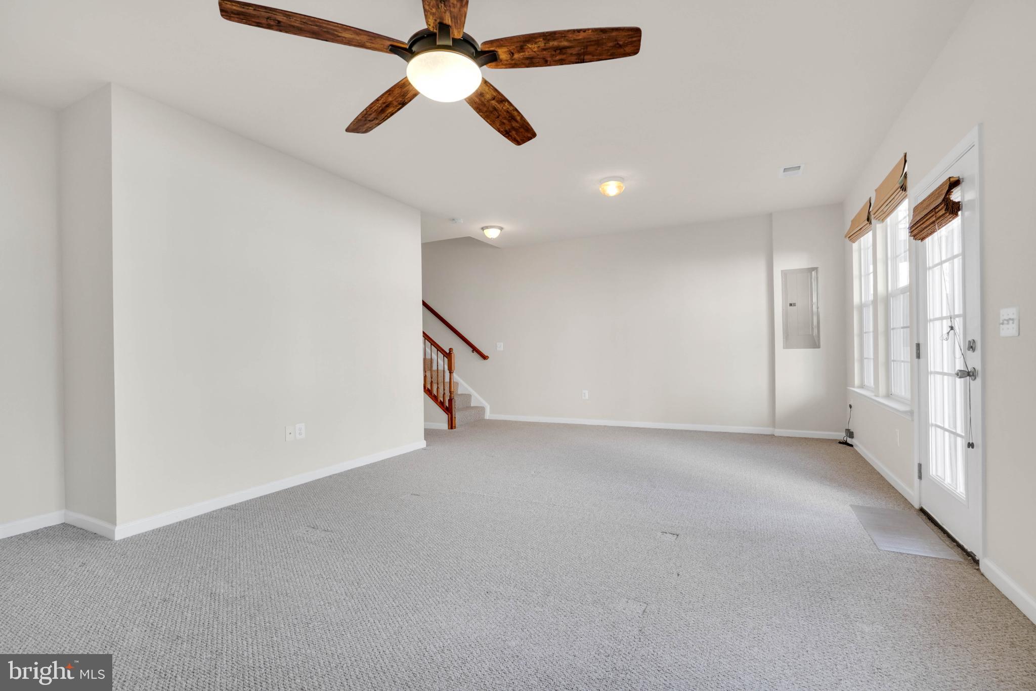 6 Lamplighter Lane Stafford, VA 22554 - Photo 15 of 37 an empty room with chandelier fan and windows