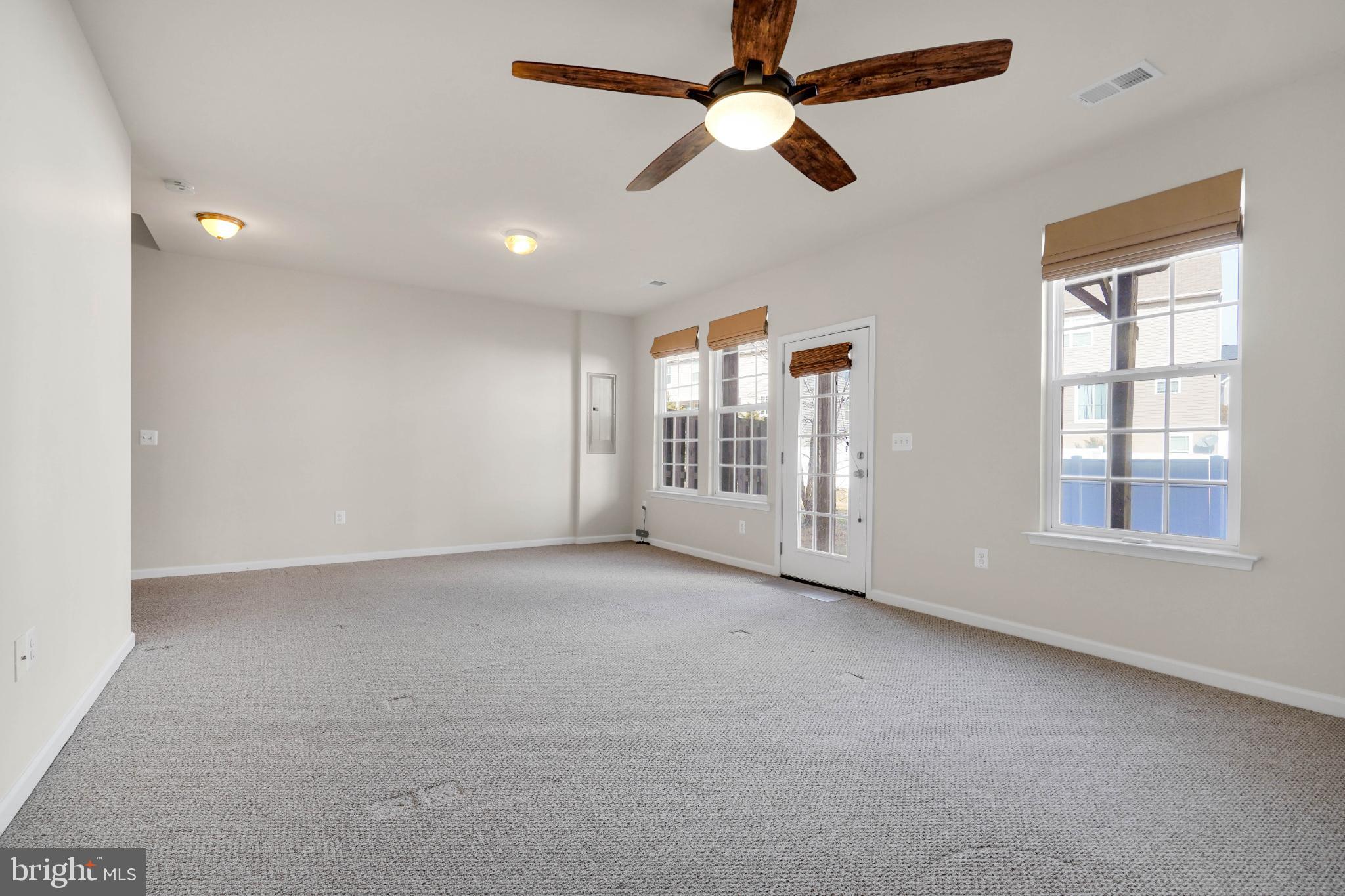 6 Lamplighter Lane Stafford, VA 22554 - Photo 16 of 37 an empty room with chandelier fan and windows
